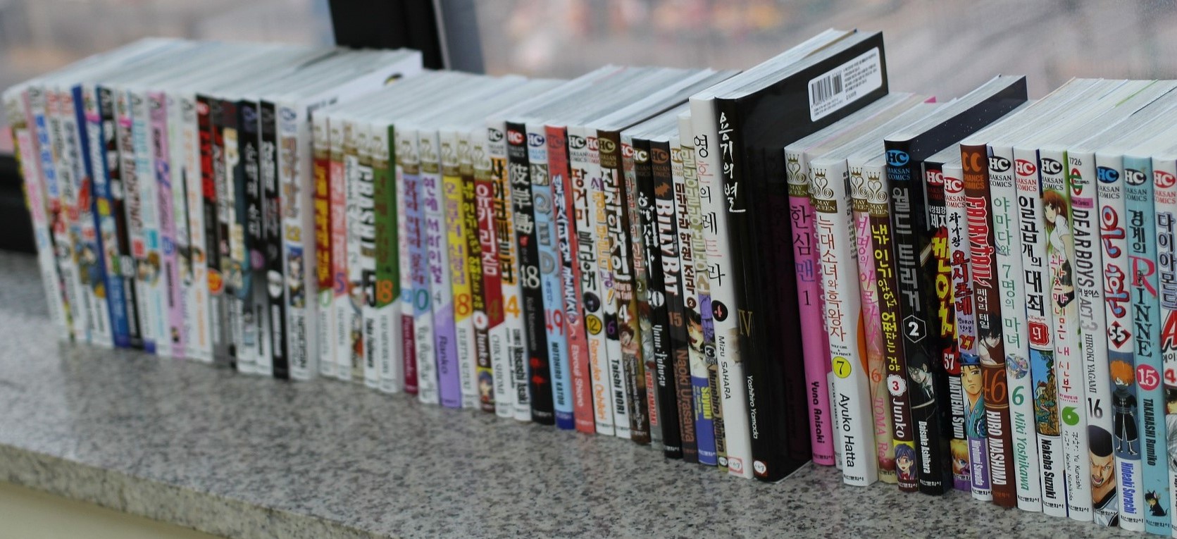 A windowsill filled with Manga